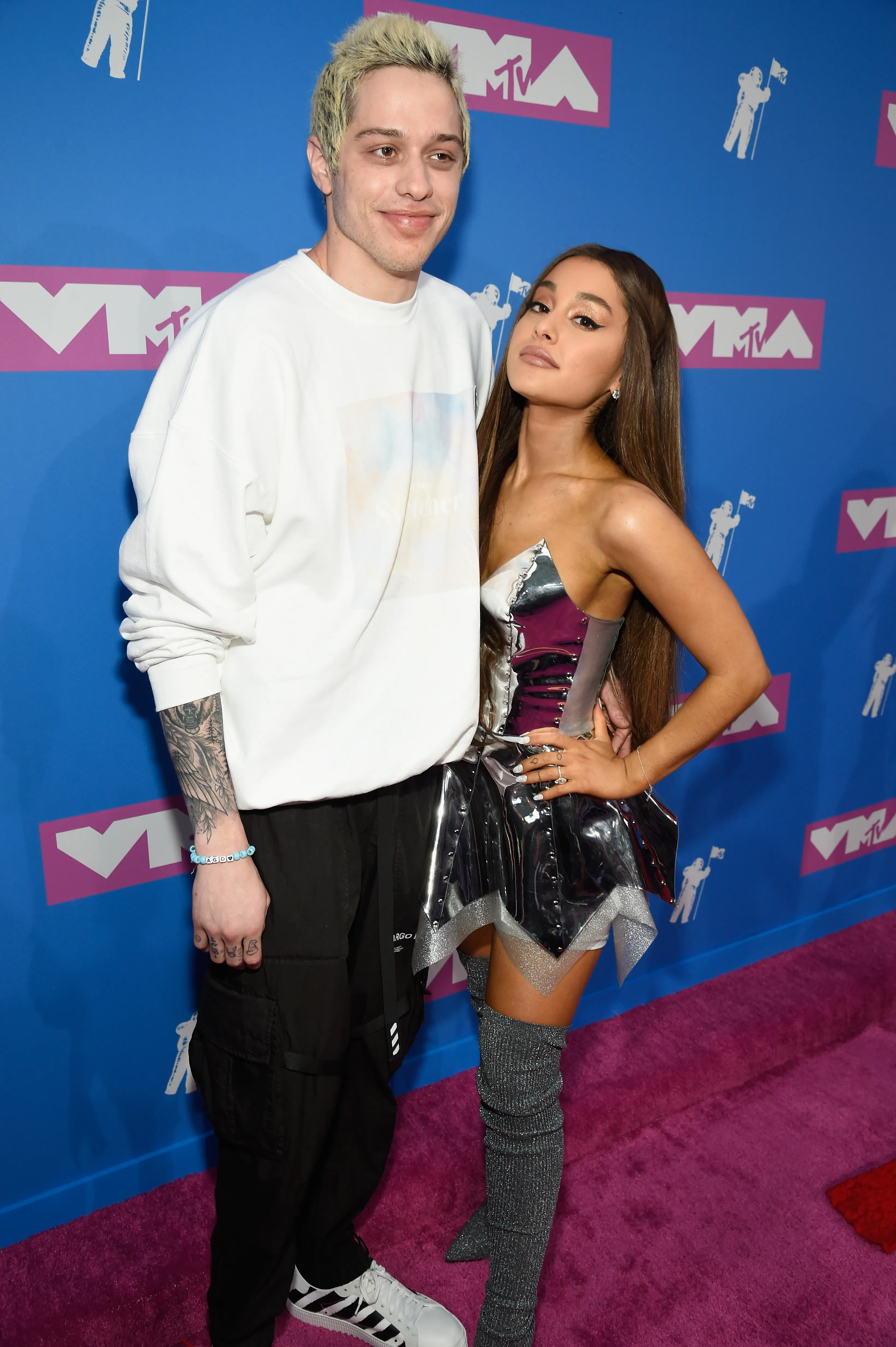 Pete Davidson and Ariana Grande pose on the red carpet at the MTV Video Music Awards.