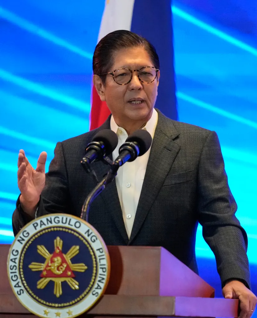 Philippine President Ferdinand Marcos Jr. gesturing while speaking at a podium.