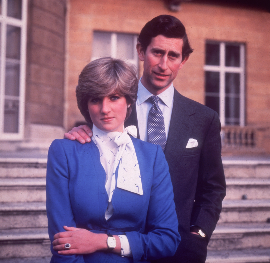 Prince Charles and Lady Diana Spencer posing for their engagement photo at Buckingham Palace.