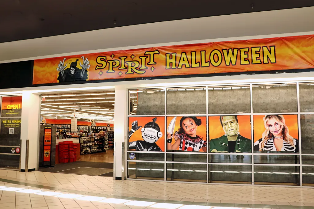The entrance to a Spirit Halloween retail store in an indoor mall, with a