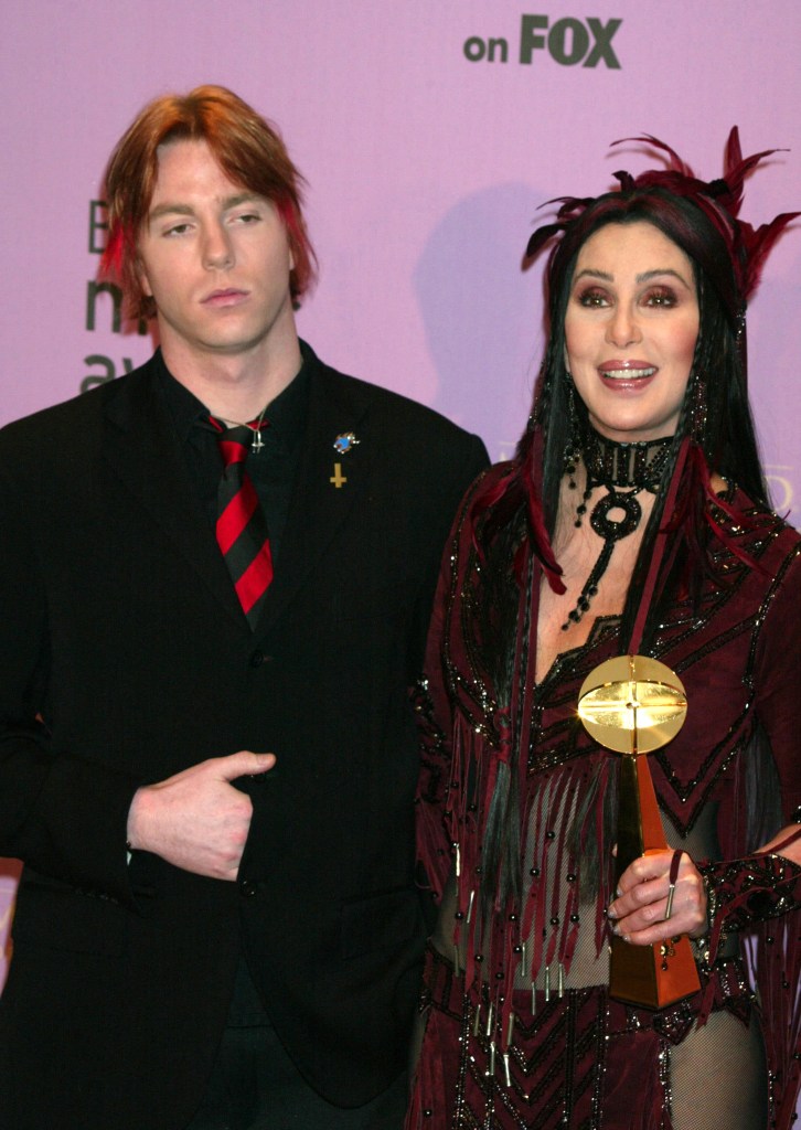 Cher and her son Elijah Blue Allman pose at an awards show.