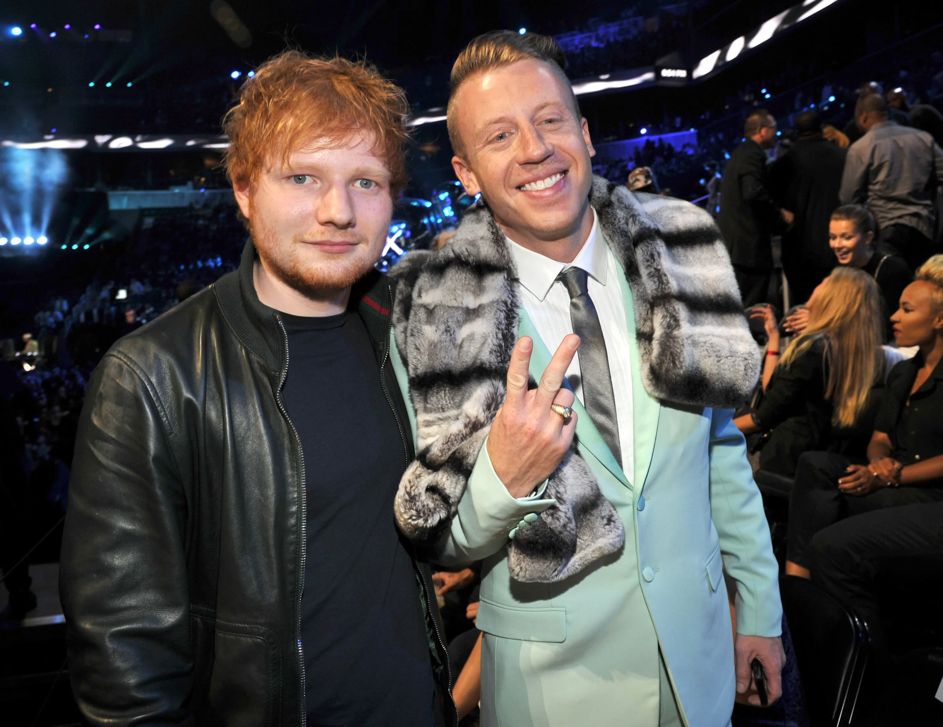Ed Sheeran and Macklemore posing for a photo.