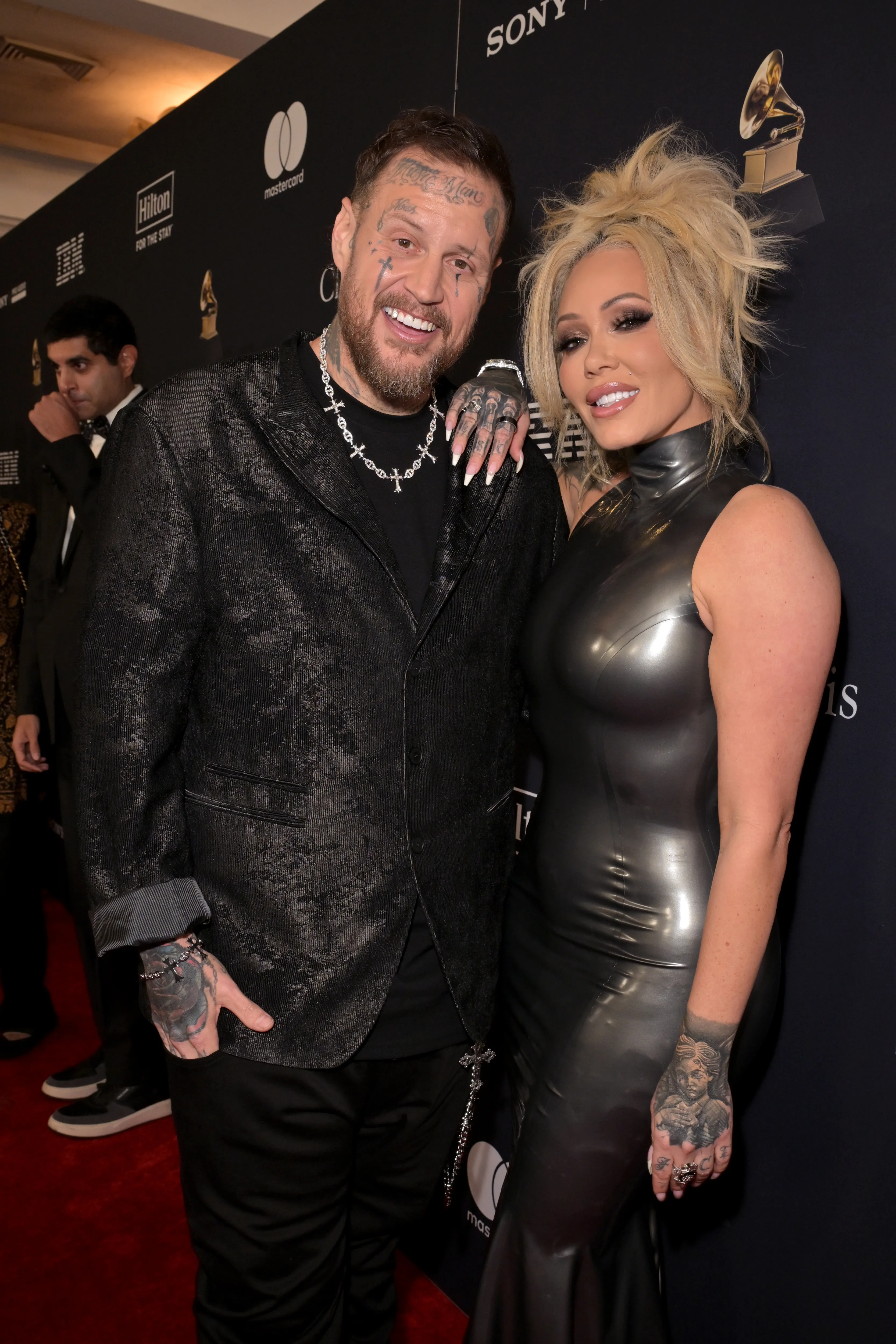 Jelly Roll and Bunnie Xo smiling at the 68th GRAMMY Awards Pre-GRAMMY Gala.