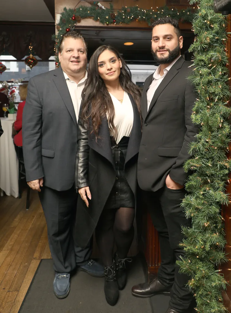 John Konstin, his daughter Sydna Constin, and his son John Konstin celebrate the 110th anniversary of John's Grill.