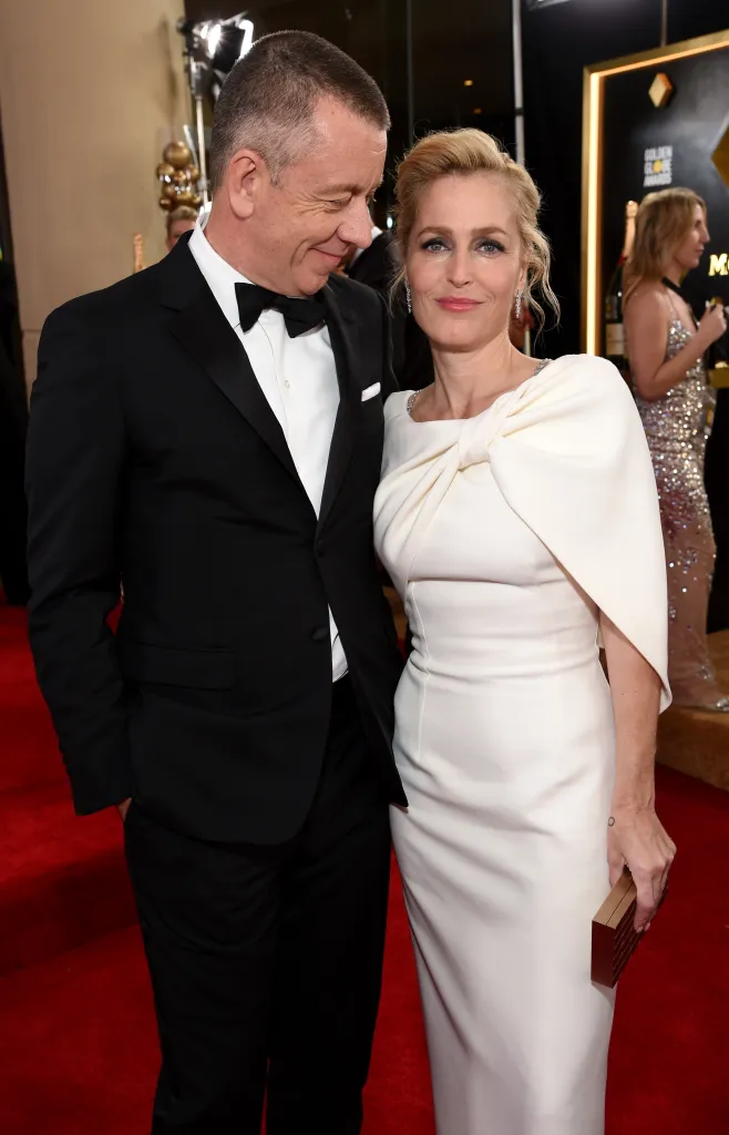 Peter Morgan and Gillian Anderson on the red carpet.