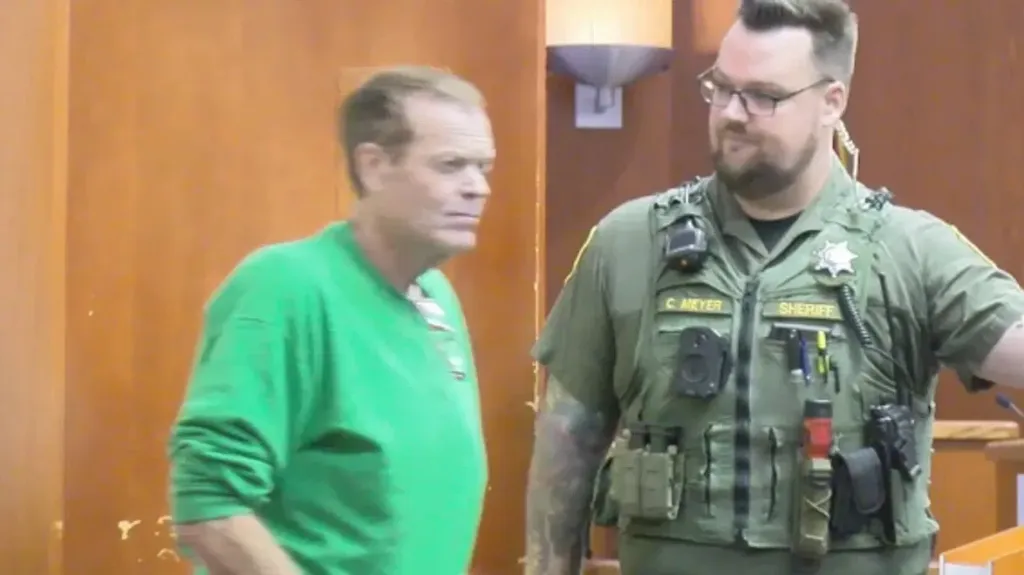 Robert Bassett next to a sheriff in Butte County Superior Court.
