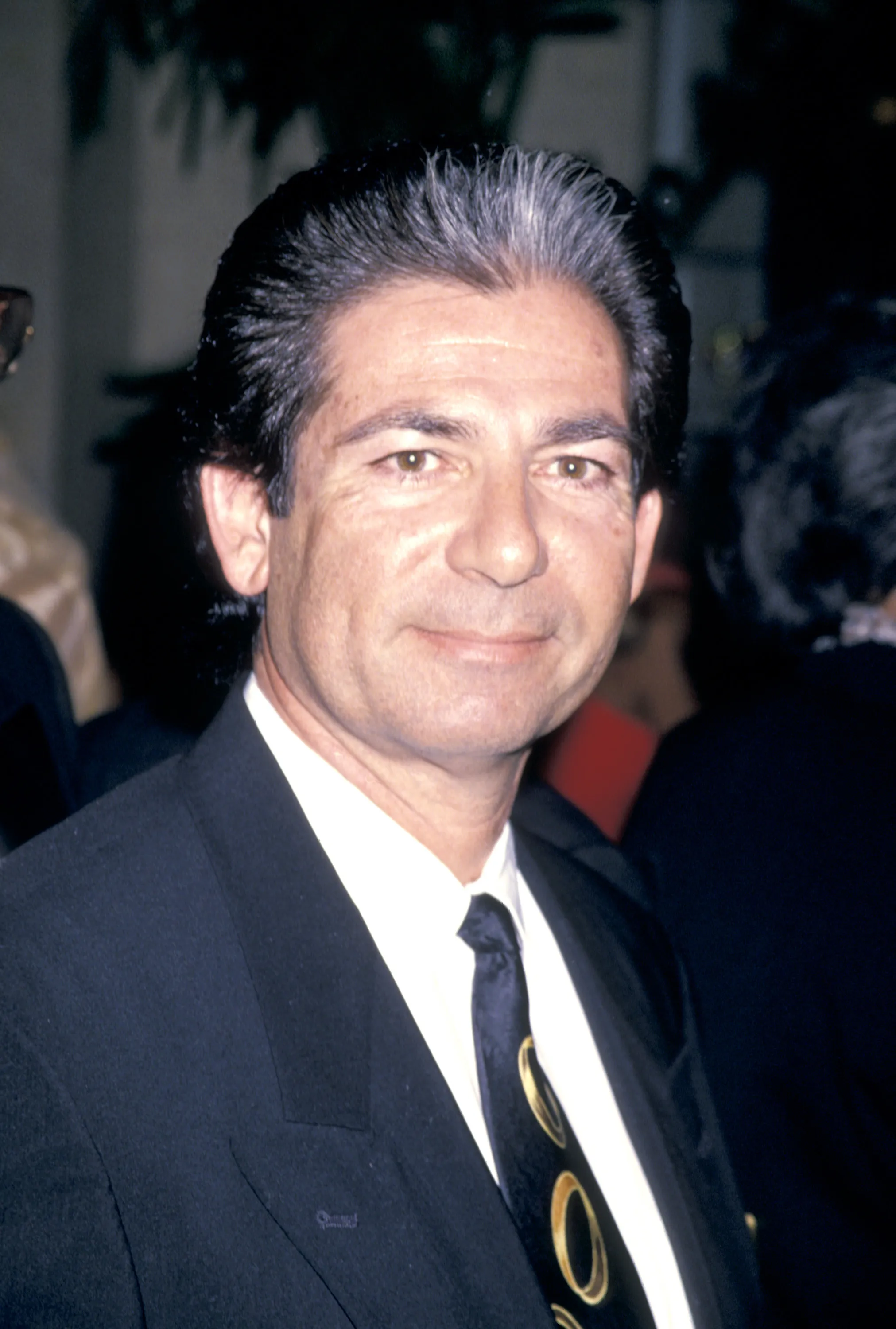 Headshot of Robert Kardashian in a suit and tie.