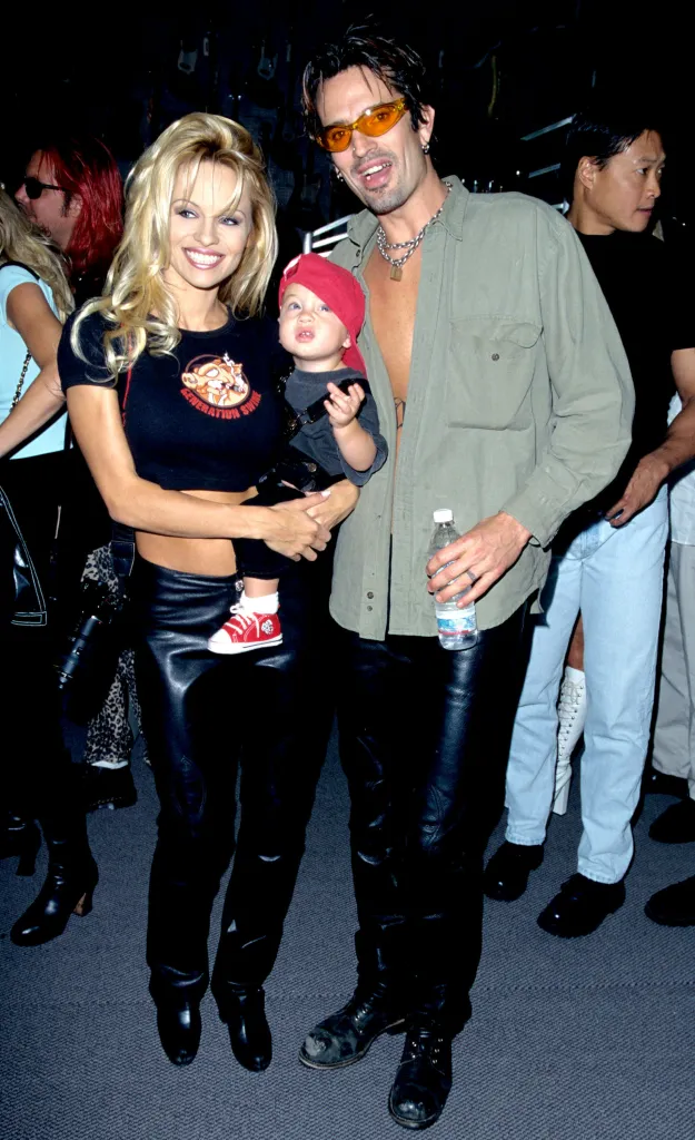 Pamela Anderson, Tommy Lee, and their son Brandon pose together.