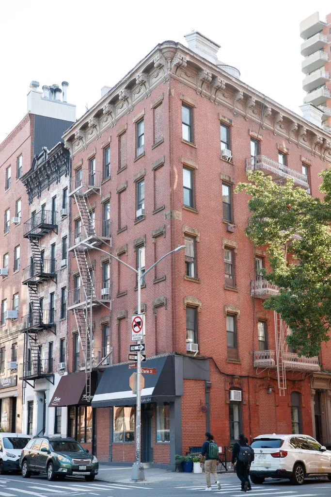 Elevated rail signs from the 1870s at Greenwich and Charles Street in New York.