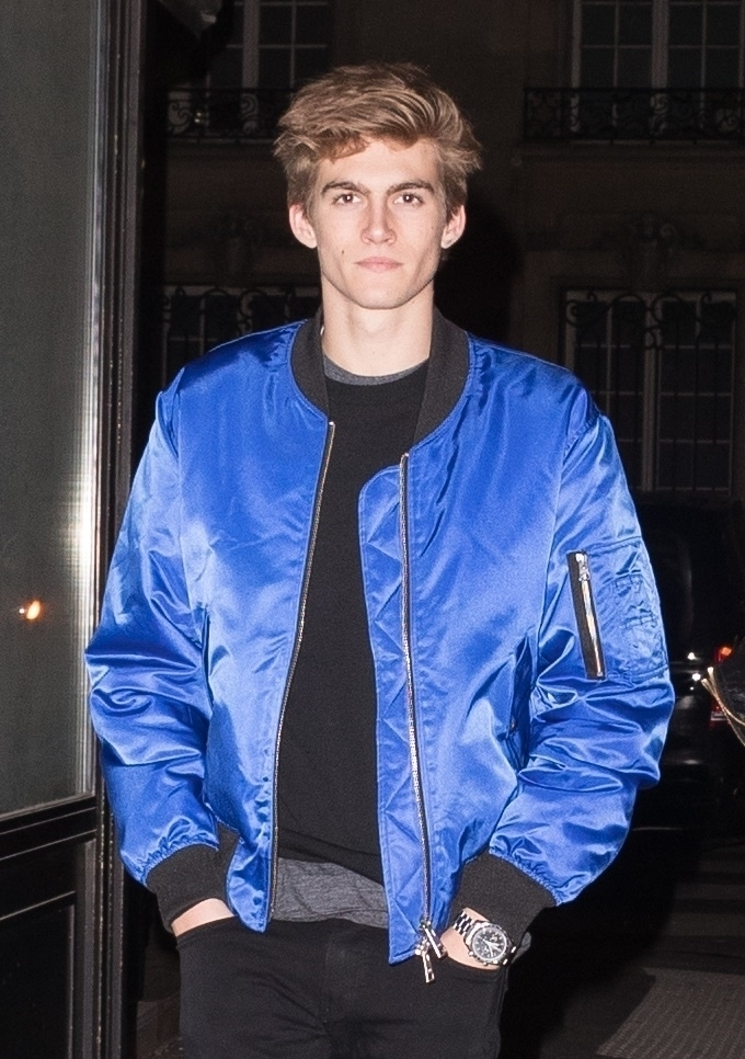 Presley Gerber in a blue bomber jacket.