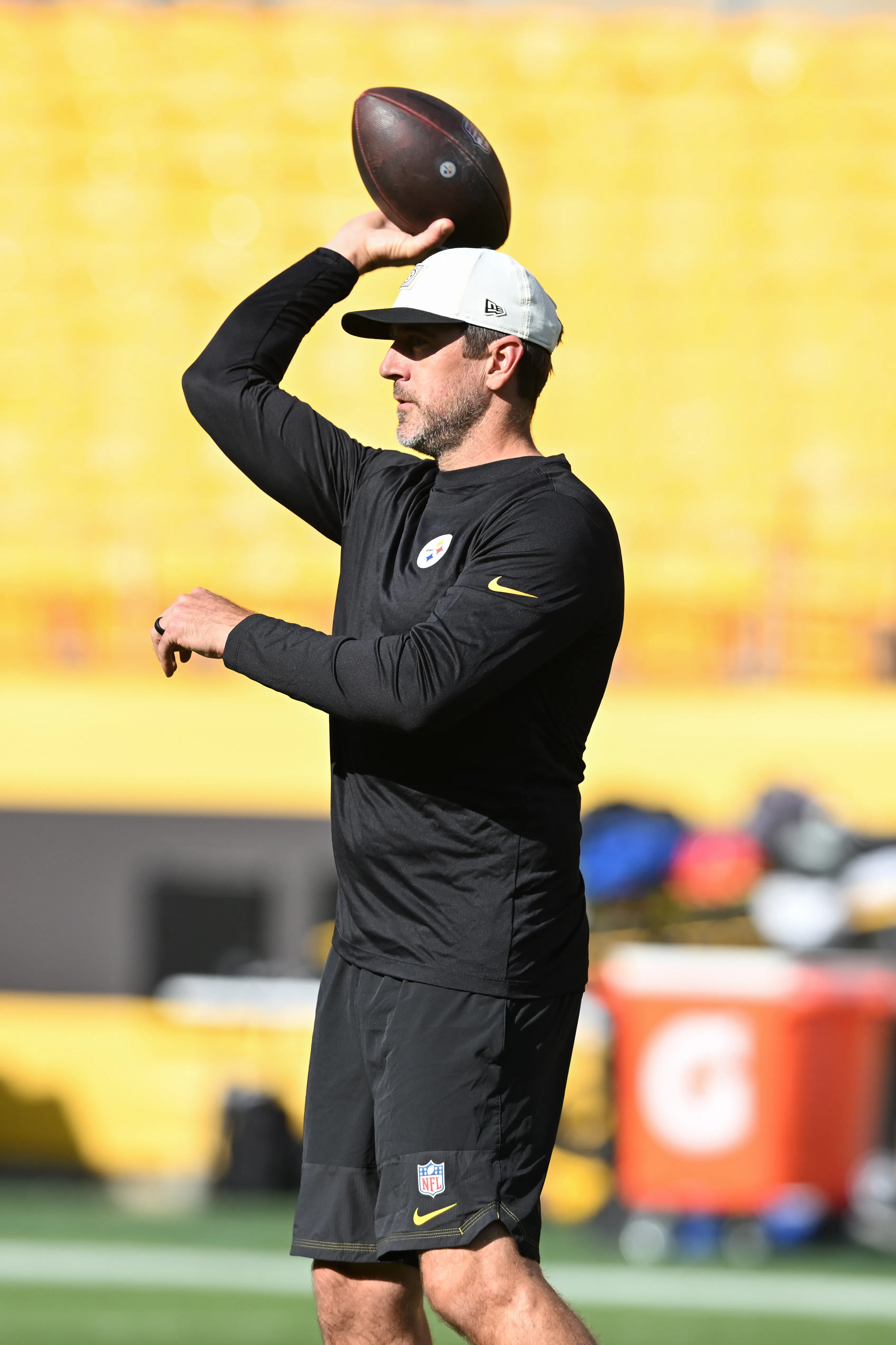 Pittsburgh Steelers quarterback Aaron Rodgers warming up with a football.