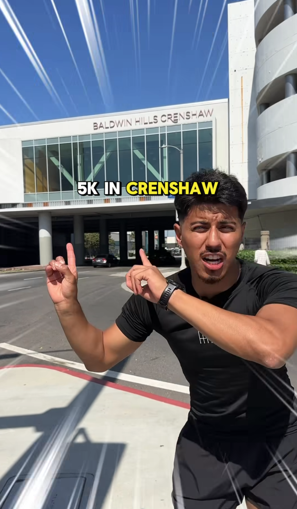 Man in front of Baldwin Hills Crenshaw mall with 