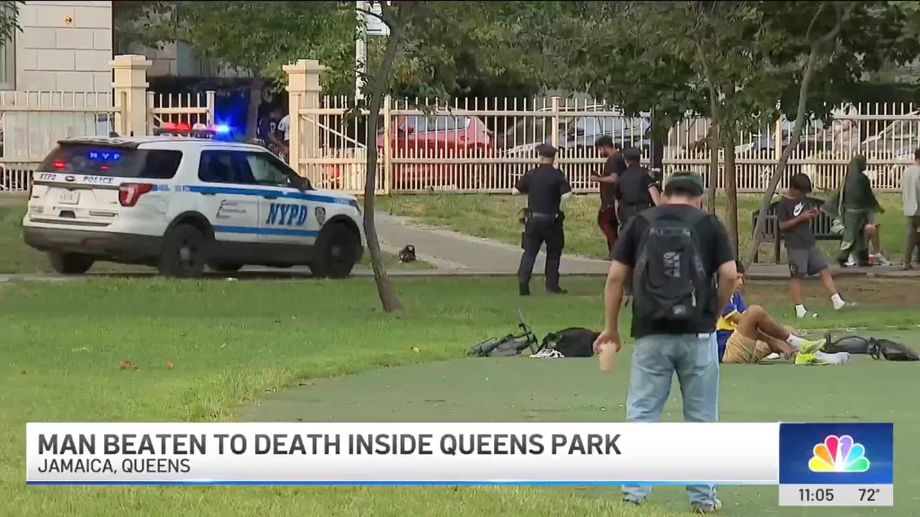 Police car with flashing lights in Rufus King Park, where a man was beaten to death.