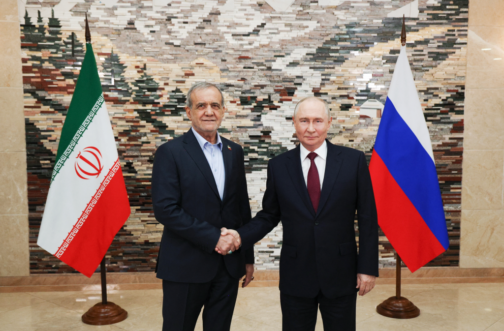 Russia's President Vladimir Putin and Iran's President Masoud Pezeshkian shake hands at the Shanghai Cooperation Organisation summit.