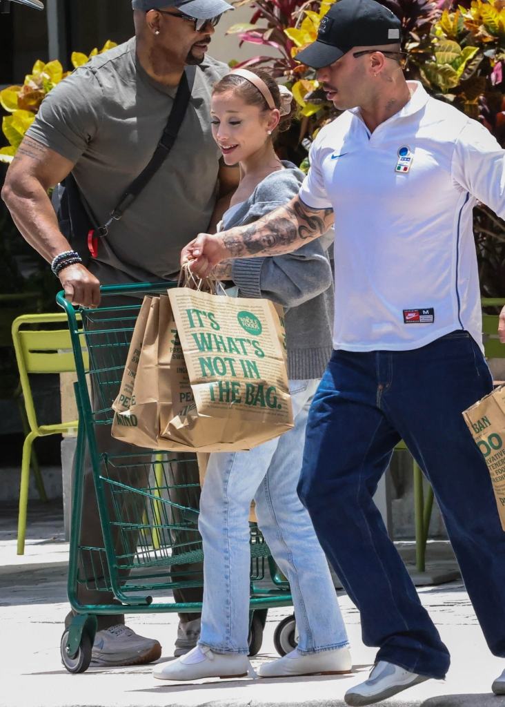 Ariana Grande and Ricky Alvarez grocery shopping at Whole Foods with a security guard.