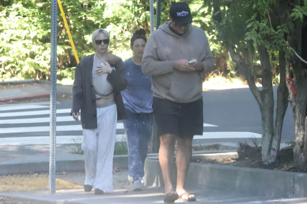 Lady Gaga walking with Michael Polansky, Alexandra Trustman, and a baby.