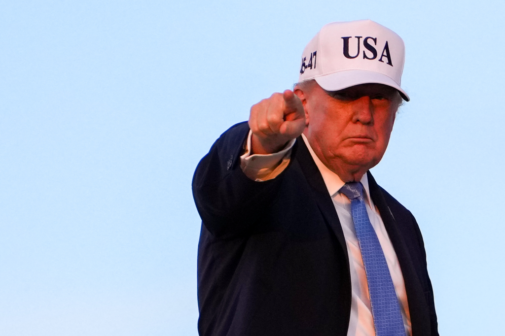 President Donald Trump, wearing a white 