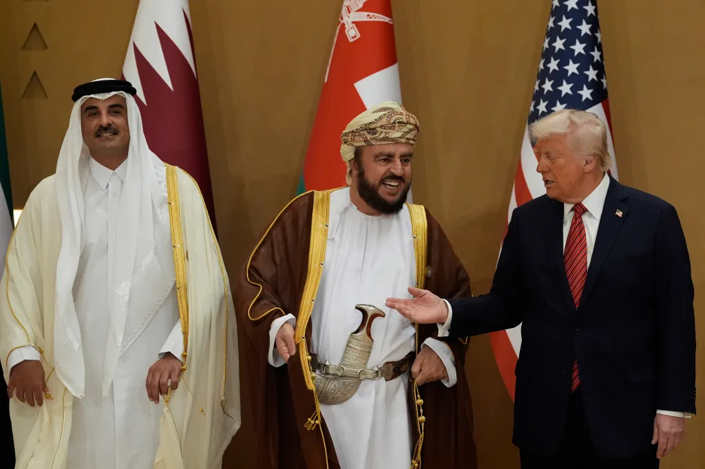 President Trump speaks with Oman's Deputy Prime Minister for International Affairs Al Sayyid Asaad Tariq Taimur Al Said, center, and Qatar's Emir Sheikh Tamim bin Hamad Al Thani as they arrive to attend a group photo with Gulf Cooperation Council leaders during the GCC Summit in Riyadh, Saudi Arabia, on May 14, 2025.