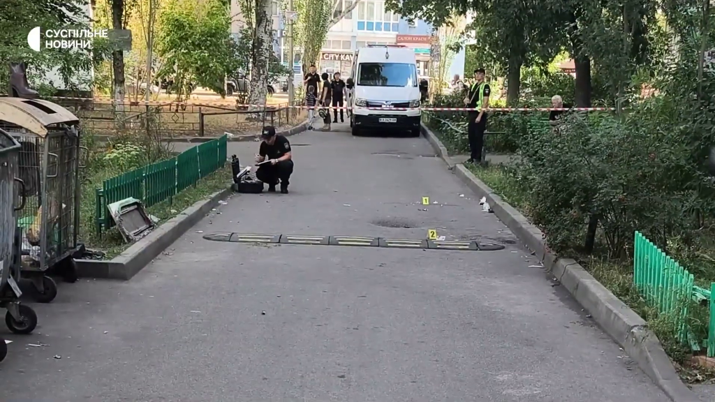 An investigator works at a cordoned-off scene after a shootout between Ukrainian intelligence agencies in Kyiv.