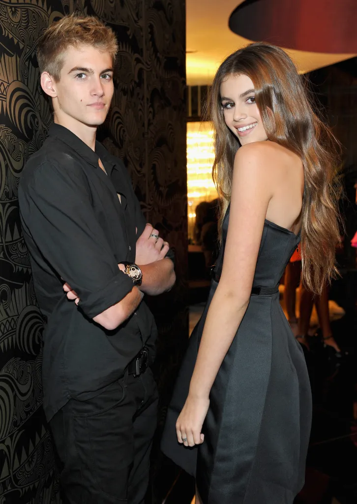 Presley and Kaia Gerber posing with a patterned wall in the background.