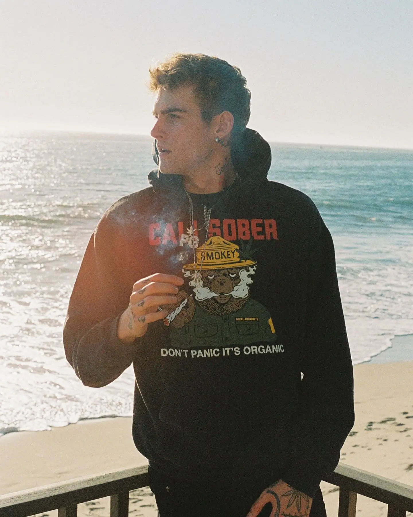 Presley Gerber smoking while wearing a 