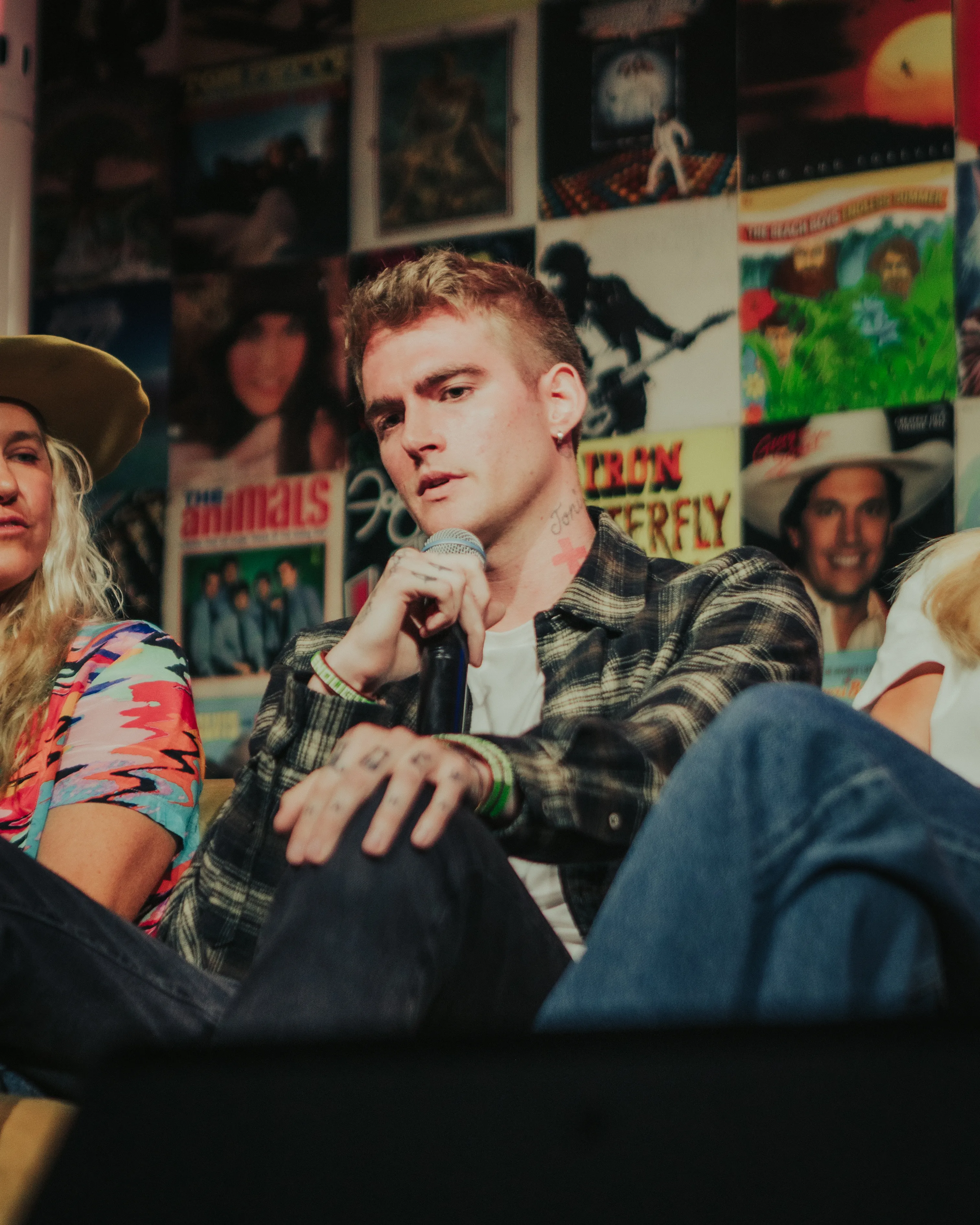 Presley Gerber speaks on a panel with two other people.