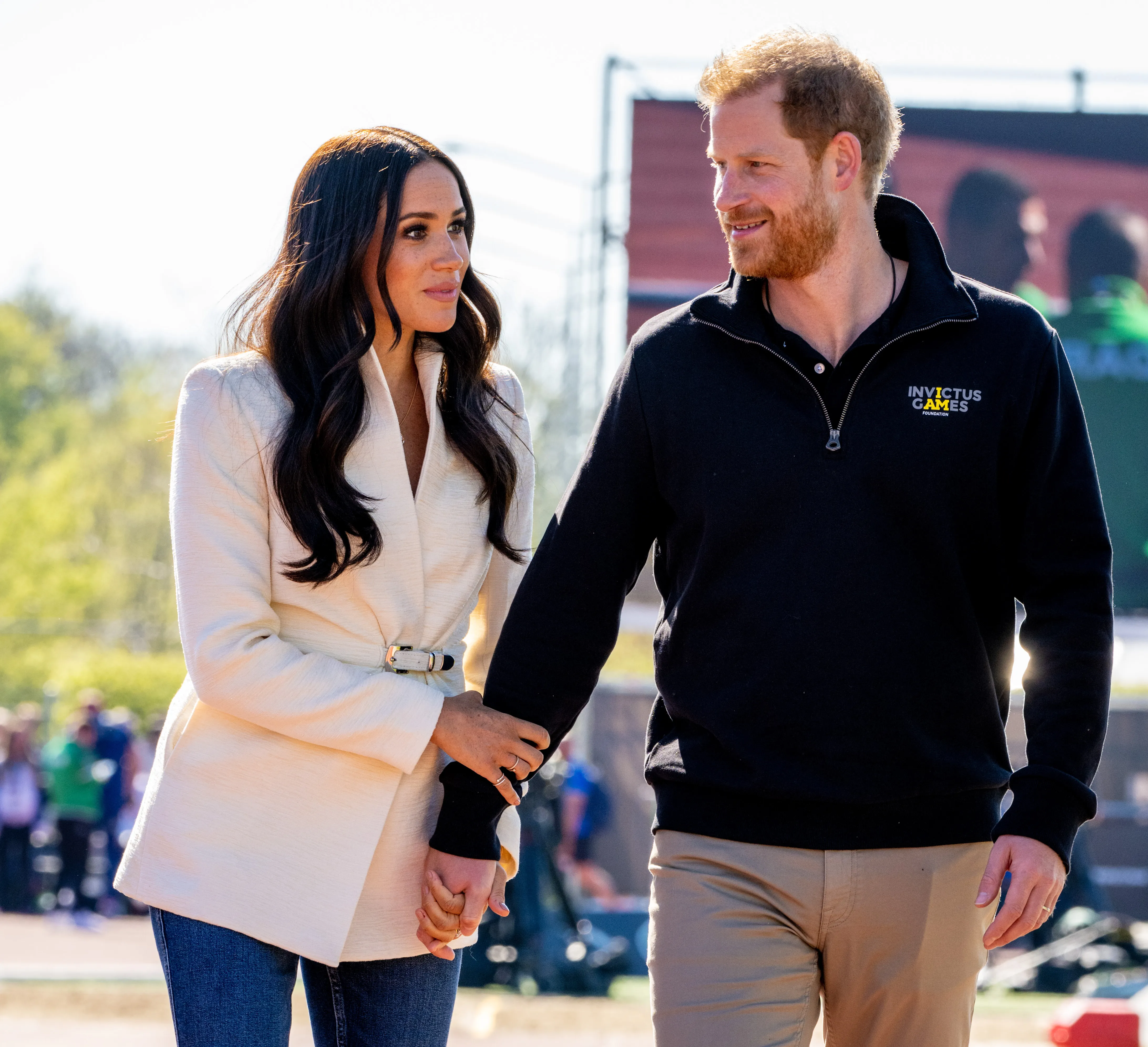 Meghan Markle and Harry pose together.