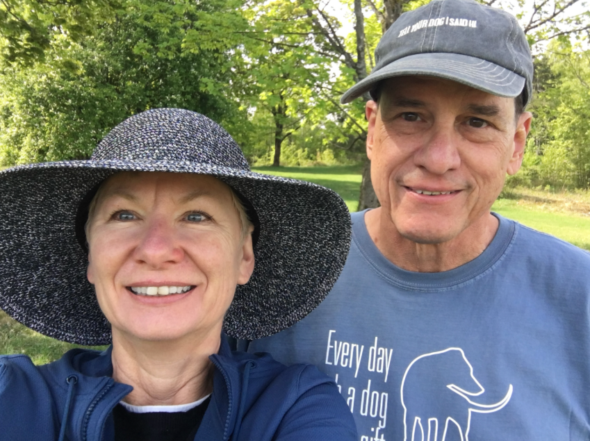 Rene and Cindy Steiner smiling for a selfie outdoors.