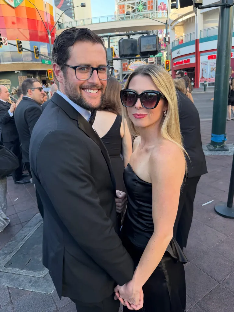 Rob and Michele Reiner's son Jake and his wife holding hands.