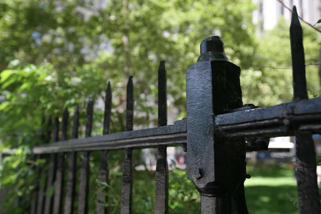 Fence posts that once held crowns at Bowling Green Park in Manhattan.