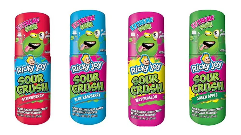 Four Ricky Joy Sour Crush candy bottles in strawberry, blue raspberry, watermelon, and green apple flavors.
