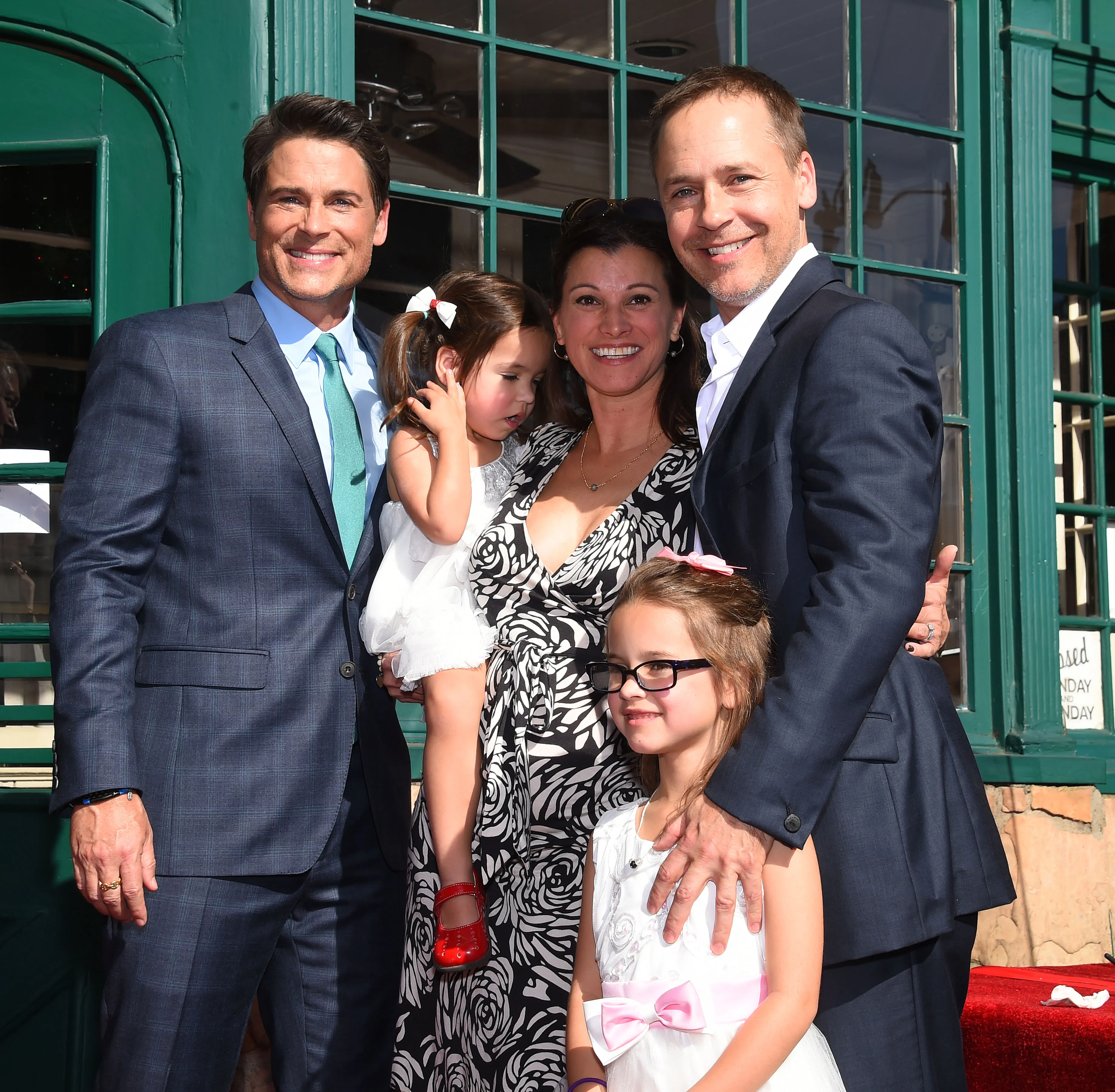Rob Lowe, Chad Lowe, Kim Painter, and their children Mabel and Fiona Lowe pose together.