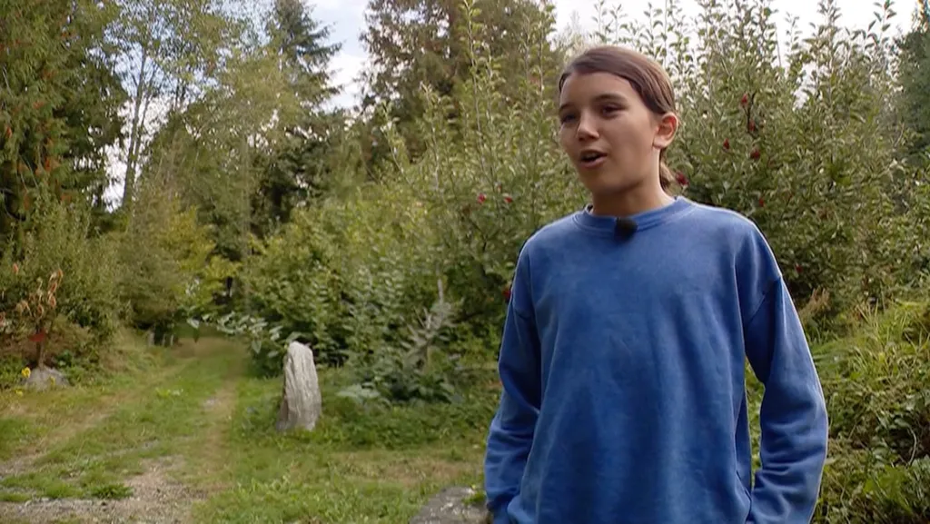 Robin Westgate, 12, in his backyard after encountering a mama bear.