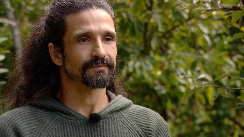 Noah Westgate, father of Robin Westgate, standing in his backyard.