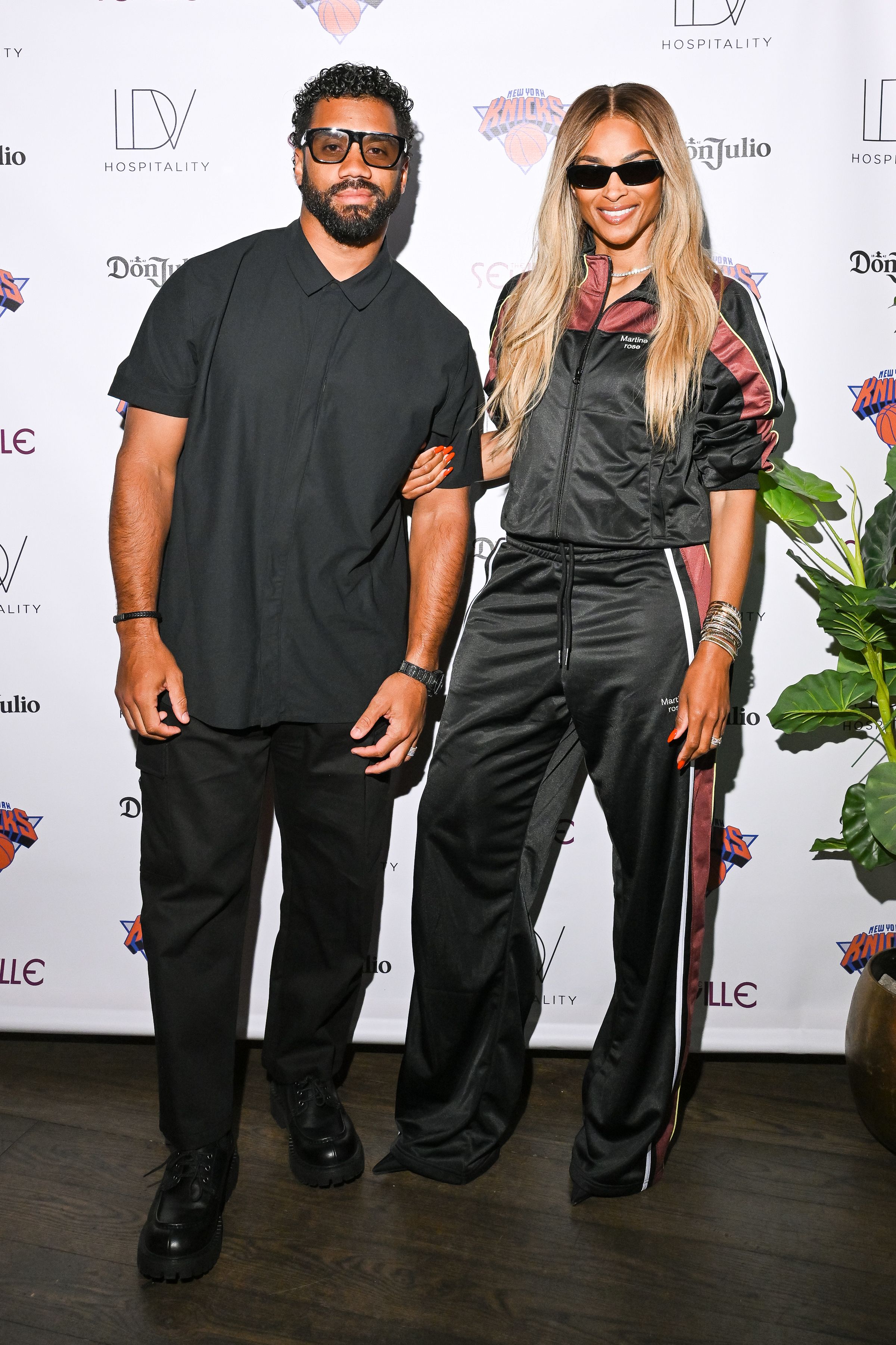 Jalen Brunson and Ciara pose together at a celebration.