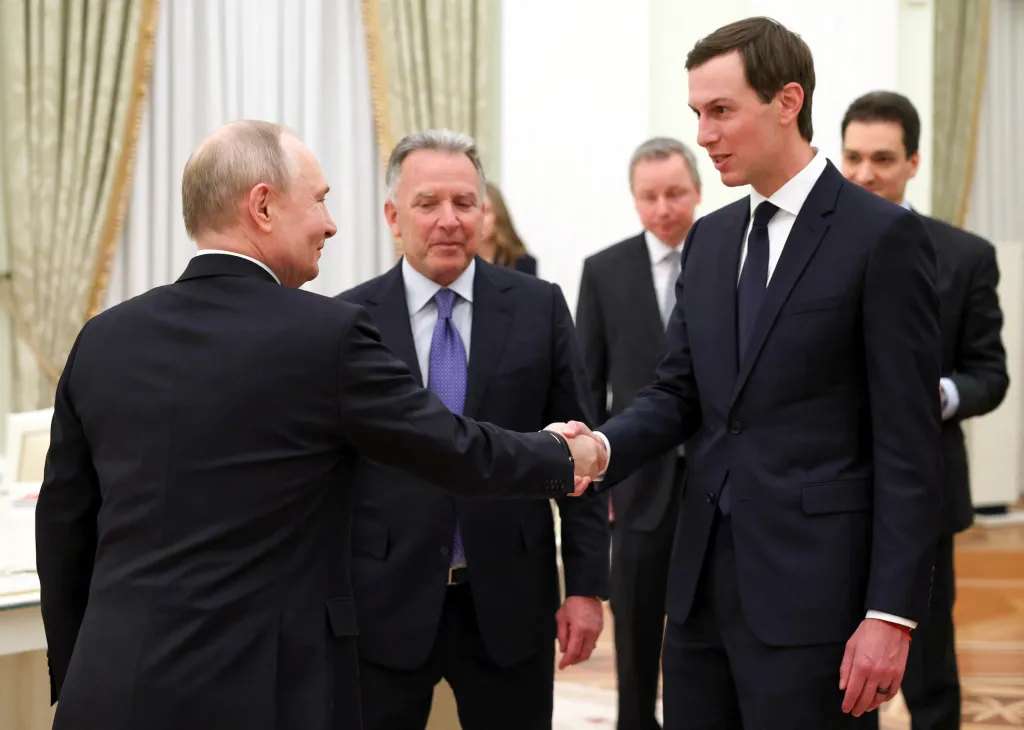Russian President Vladimir Putin shakes hands with Jared Kushner, with Steve Witkoff behind Putin.