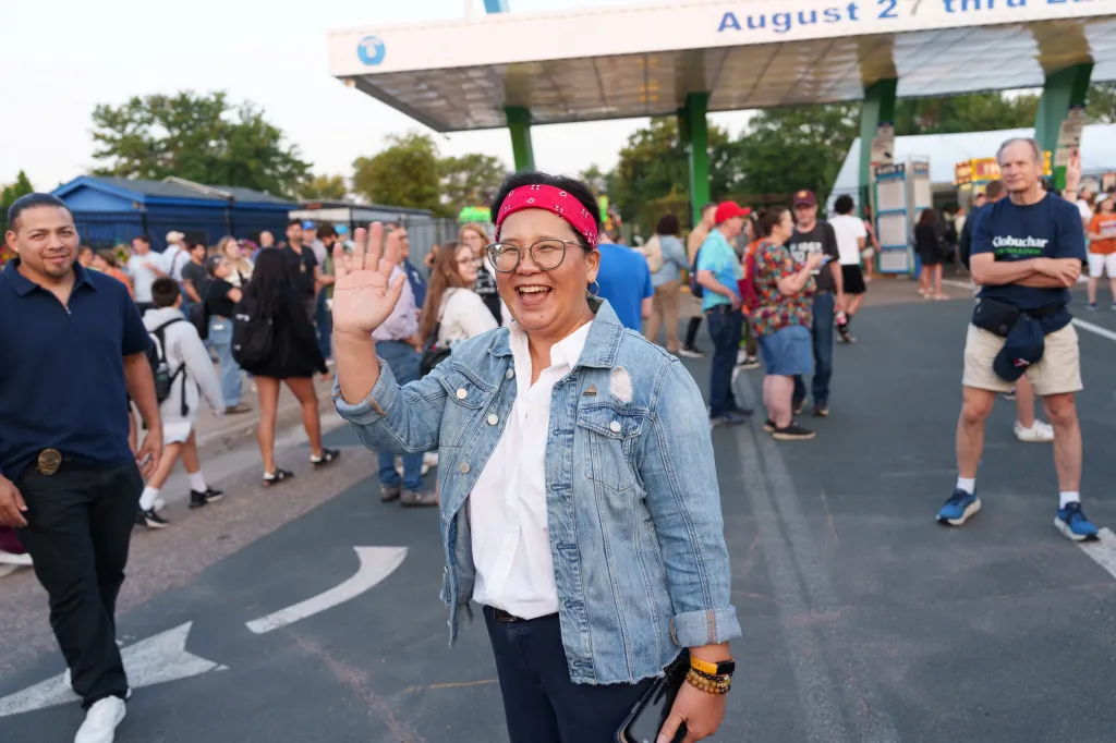 Saint Paul Mayor Kaohly Her waves to guests at the opening day of the Minnesota State Fair.