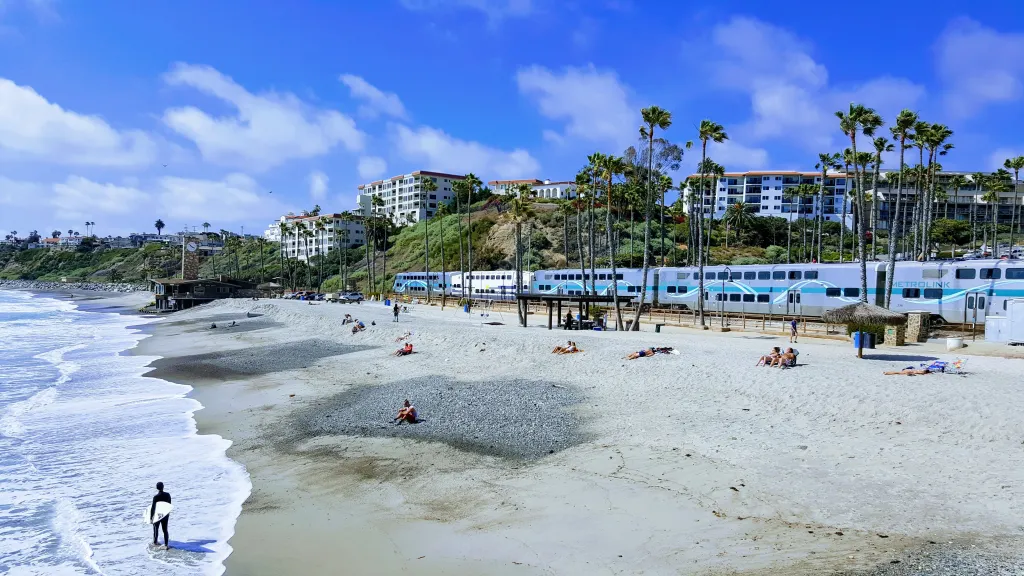 San Clemente beach with a Metrolink train passing by.