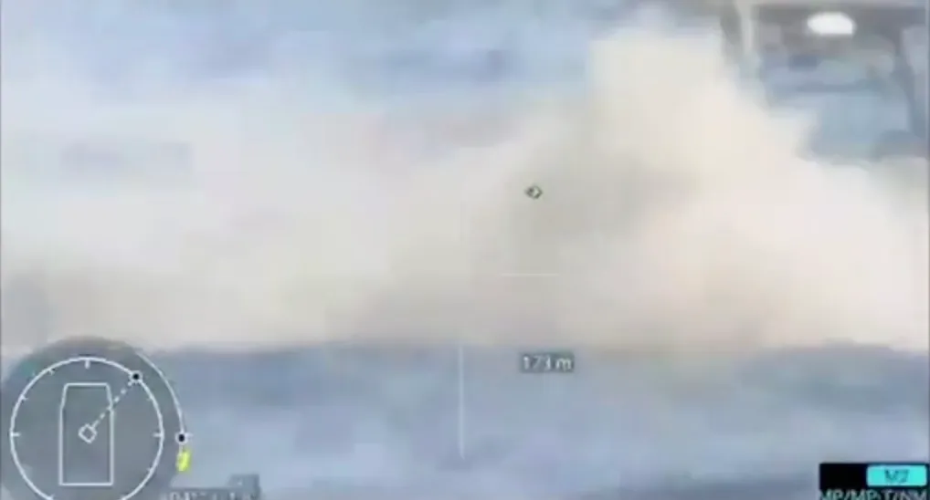 A Ukrainian naval drone destroying a Russian unmanned boat in the Black Sea, with smoke and water exploding upwards.