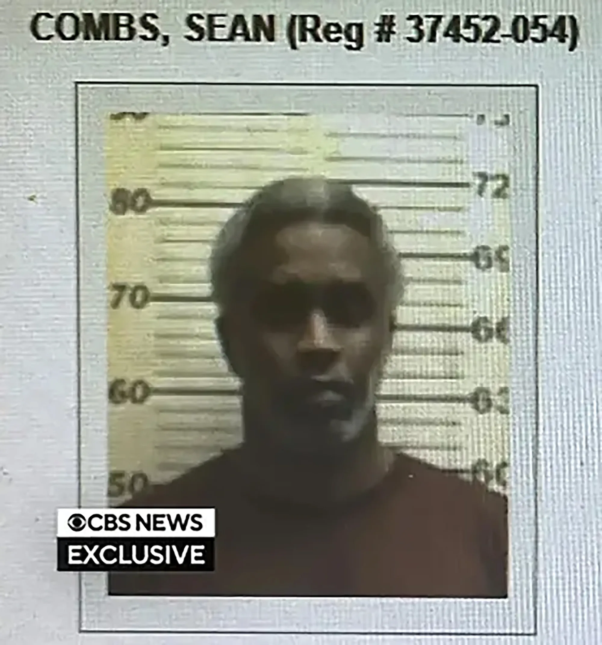 Mugshot of Sean Diddy Combs against a height chart.