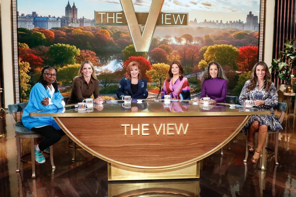 The hosts of The View, Whoopi Goldberg, Sara Haines, Joy Behar, Ana Navarro, Sunny Hostin, and Alyssa Farah Griffin, sitting at their desk.