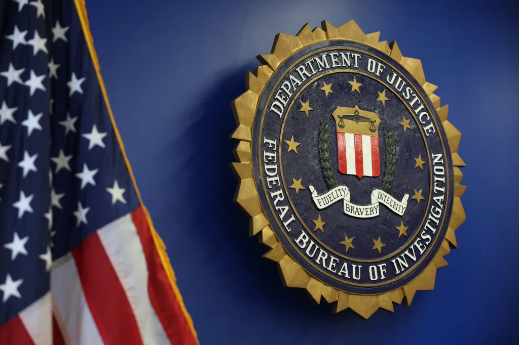FBI logo and a U.S. flag.