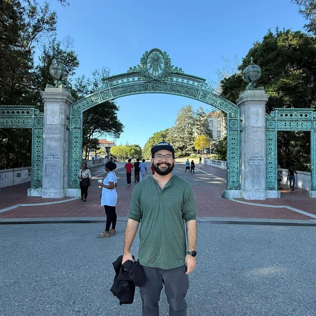 Jonathan McKinsey, a tech executive at The New York Times, stands in front of a large, ornate gate.