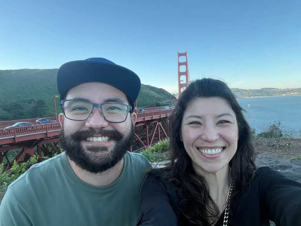 Jonathan McKinsey and his sister Mitra Dimitrov pose for a selfie with the Golden Gate Bridge in the background.