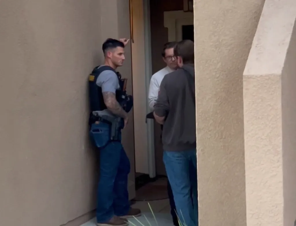 Police officers outside the residence of Candice Jang.