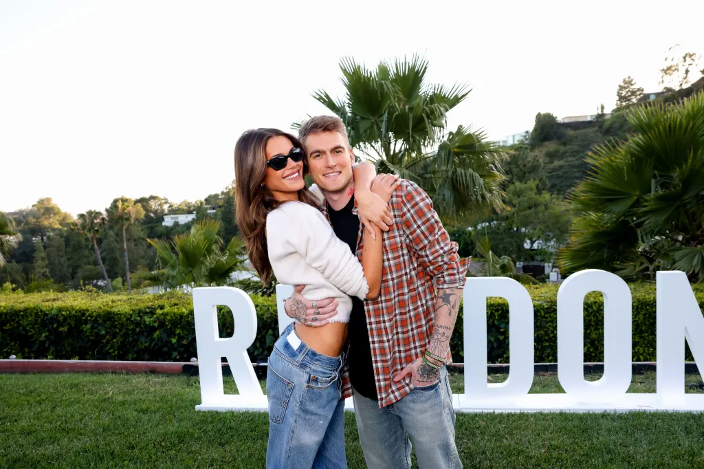 Kaia Gerber and Presley Gerber smiling and embracing at the RE/DONE 