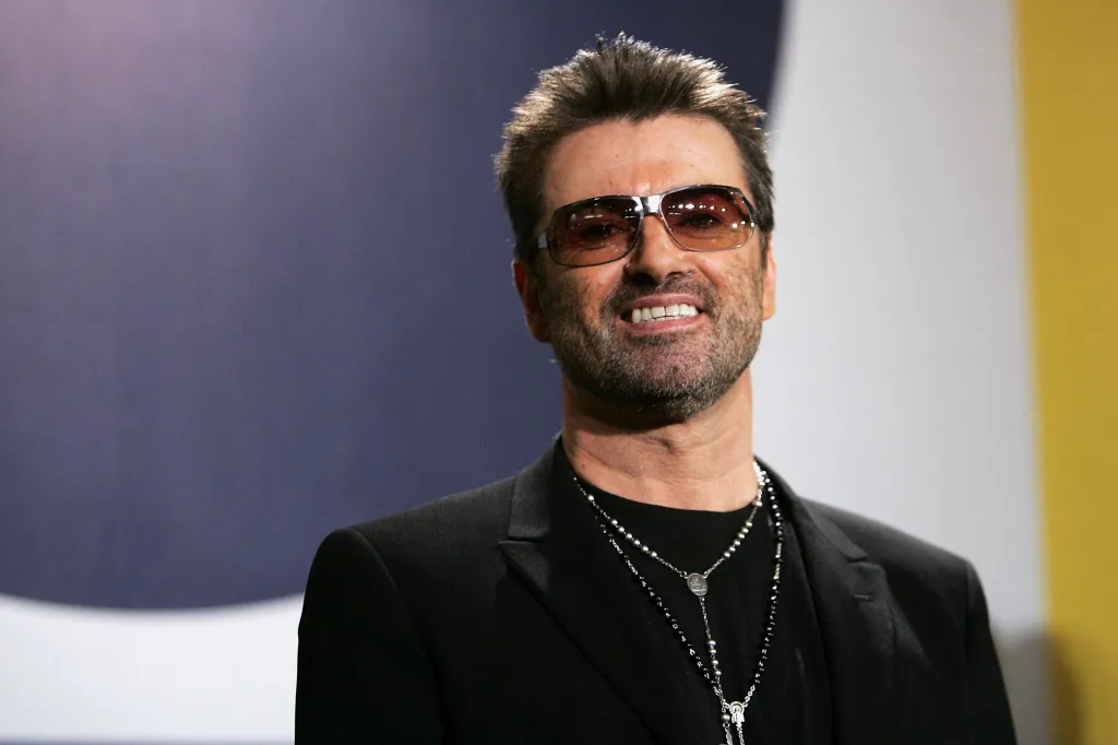 George Michael smiles at the 