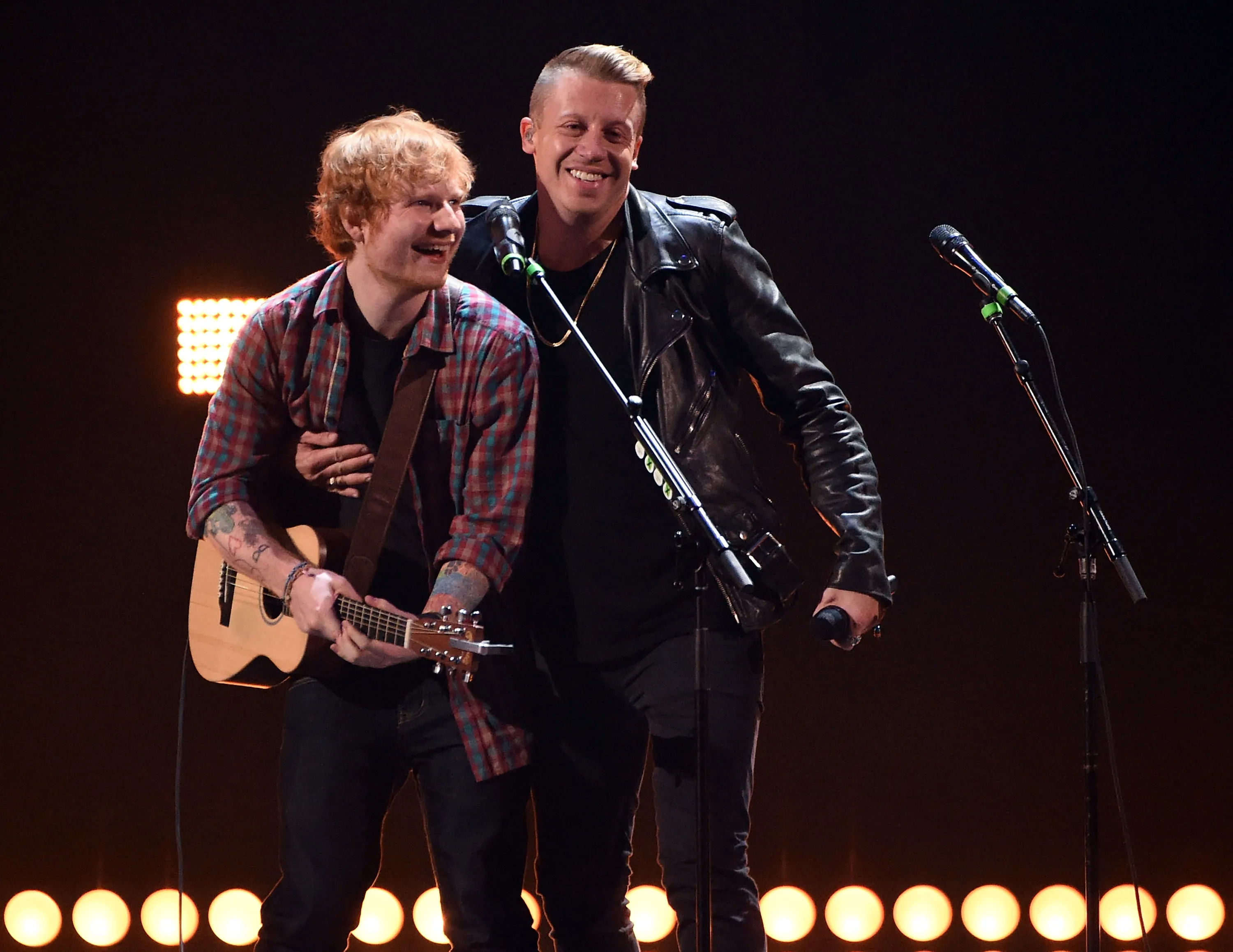 Ed Sheeran (L) and Macklemore perform during the 2014 iHeartRadio Music Festival.