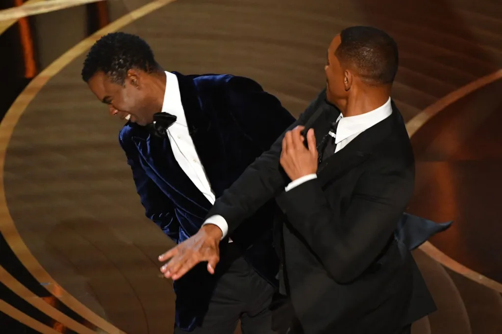 Will Smith slapping Chris Rock on stage at the Oscars.