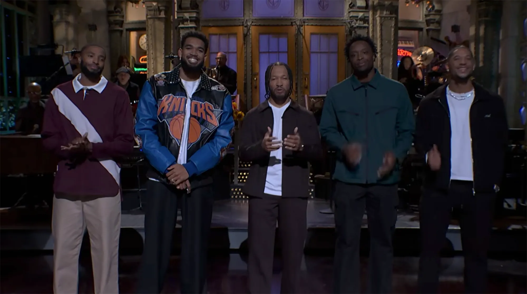 Jalen Brunson and his Knicks teammates standing on the Saturday Night Live stage.
